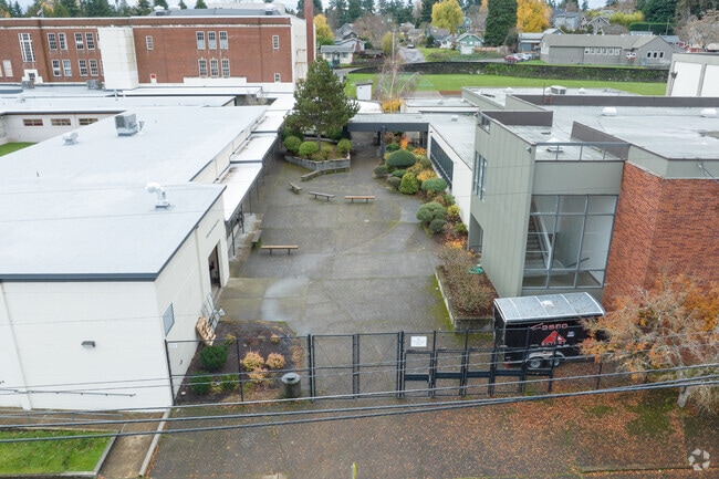 A courtyard provides outdoor seating at the Clackamas Academy of Industrial Sciences on 12th St.