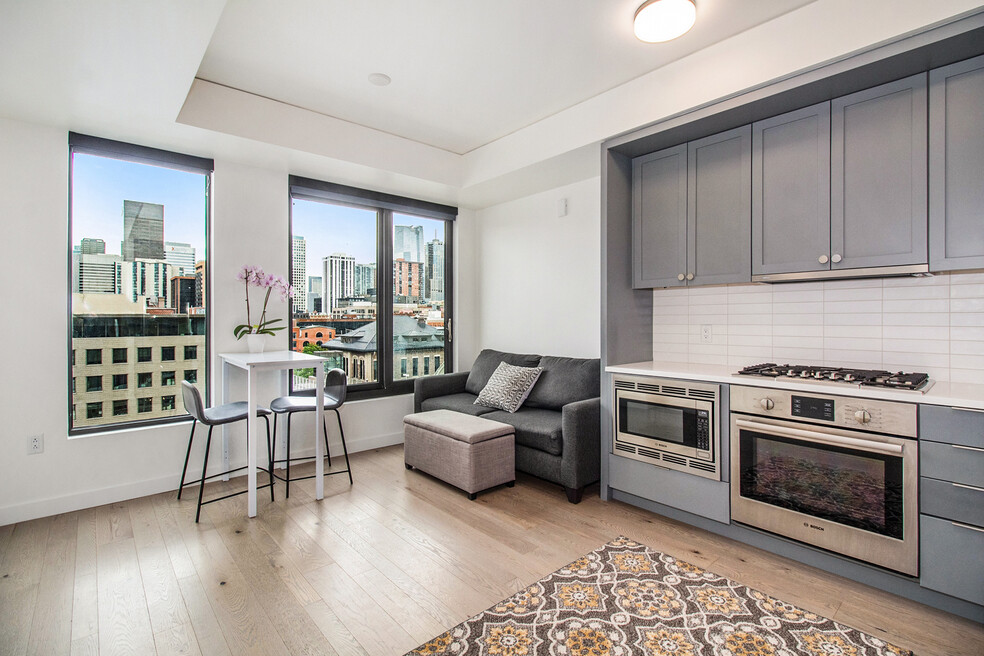 Beautiful living area and kitchen. Eat dinner while enjoying views of Union Station and downtown!