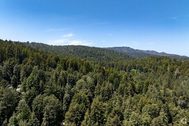 The redwood-lined ridges surrounding Ben Lomond showcase the lush, forested slopes of the Santa Cruz Mountains, where outdoor adventure and peaceful seclusion go hand in hand.