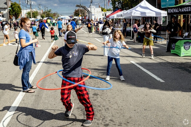 Hula hoop contests occur periodically throughout the Mineola Street Fair.