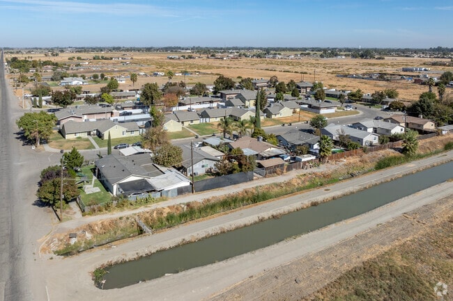 Irrigation canals run alongside the streets in South Dos Palos.
