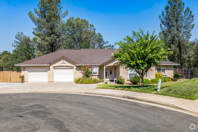 This modern ranch-style home has stucco siding and a tile roof in Hawley.