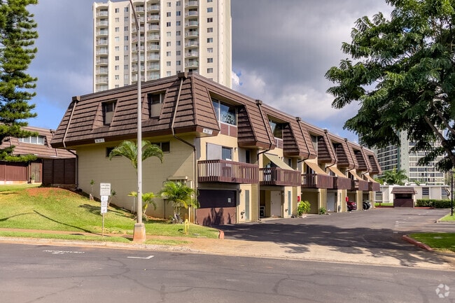 These townhomes feature an attached garage and additional parking.