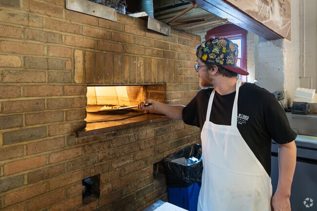 This chef is making a great pizza at The Works Brick Oven right in Stonebridge.