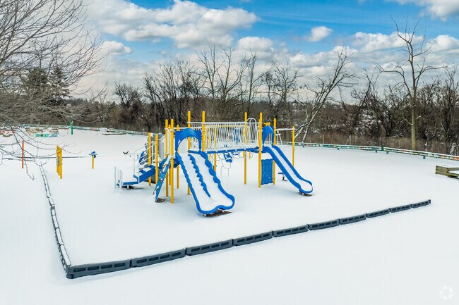 Younger students at the Braddock Hills High School building take advantage of the tot-lot.