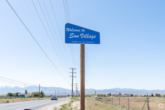 The Welcome to Sun Village sign is on the east side of town.