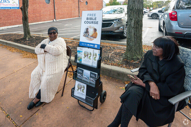 Local enjoy sitting outside and helping spread the word to others in Pineview.