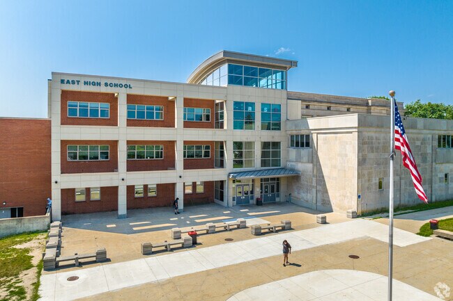 Des Moines East High School is just north of East Village along I-235.