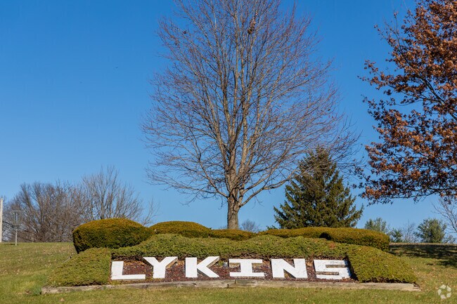 A unique sign welcomes visitors to Lykins Park.