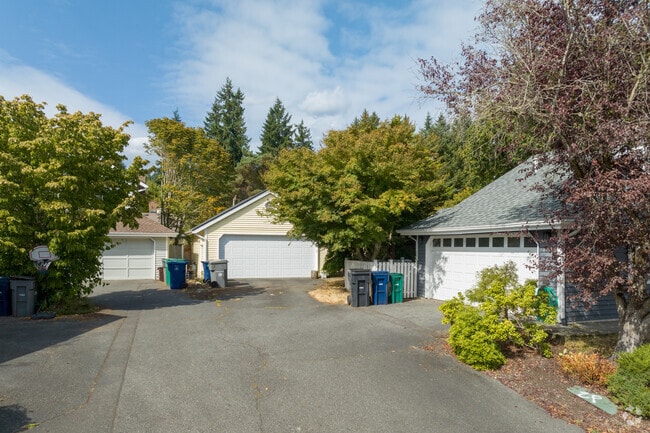 Garages and tree-lined lots define Bear Creek’s quiet residential character.