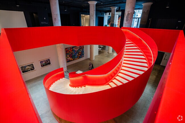 This striking red staircase leads Crosstown Concourse visitors up to Crosstown Arts and Art Bar