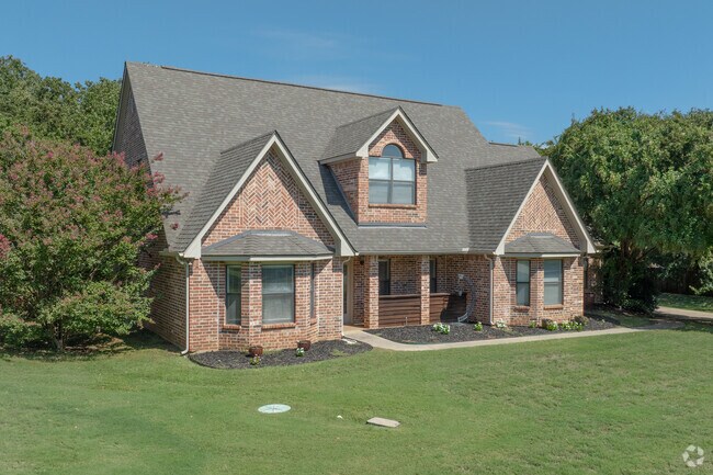 New traditional brick homes bring timeless style to Double Oak's residential roads.