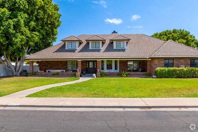 Indulge in the rich heritage and classic elegance of Mesa Patios' Tudor Revival architecture.