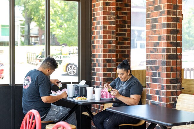 Locals enjoy the authentic food at Mexican Taco Shop in Elmhurst.