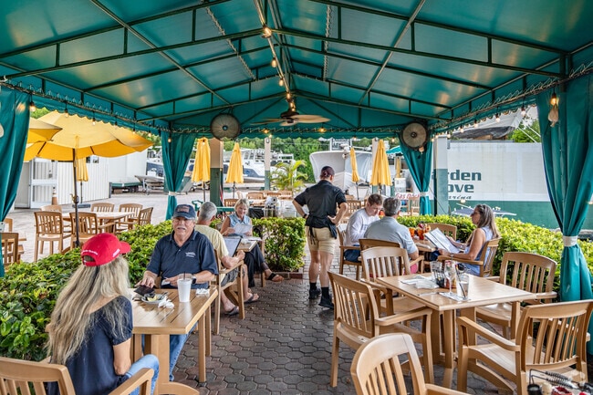 Enjoy a waterfront view while dining on seafood at The Buzzard's Roost.