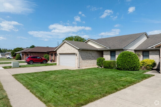 Tidy front yards line the streets of Lake Pointe as an active HOA keeps things in check.
