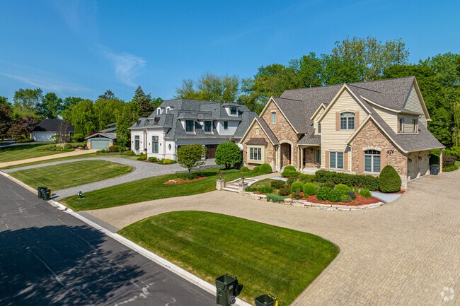 A row of beautiful spacious homes on a residential street in the Brook Forest neighborhood.