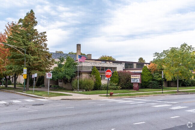 An American flag flaps in the wind in front of Bethesda International Academy.