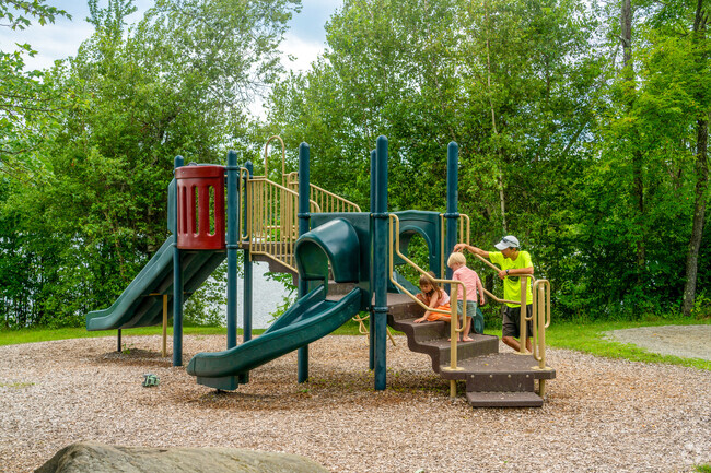 A family plays on the playground at Lake Iroquois Beach near Saint George.