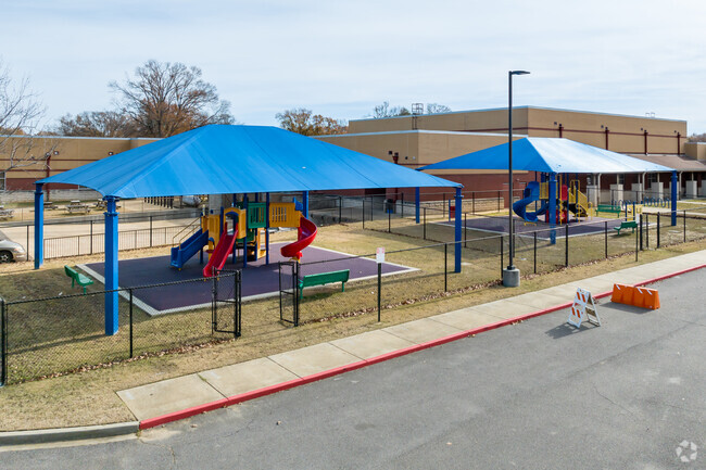 Kids stay cool on hot days under the shaded playground at Westhaven Elementary in Memphis.