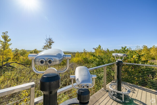 Binoculars are near an overlook by the seating in McHenry County Conservation in Bull Valley.