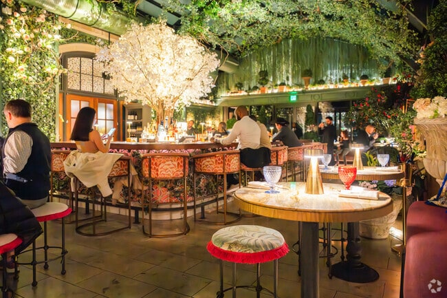 Peachtree Corridor locals can take a short trip to the city's best restaurant, like Garden Room, known for elevated fare & whimsical feel.