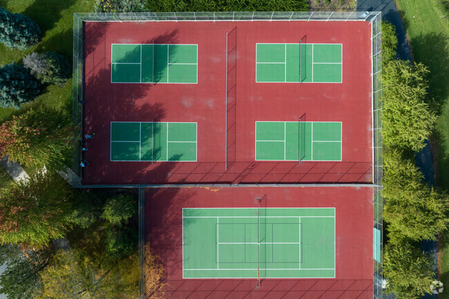 Pickleball courts sit alongside a tennis court in Indian Chase Meadows.