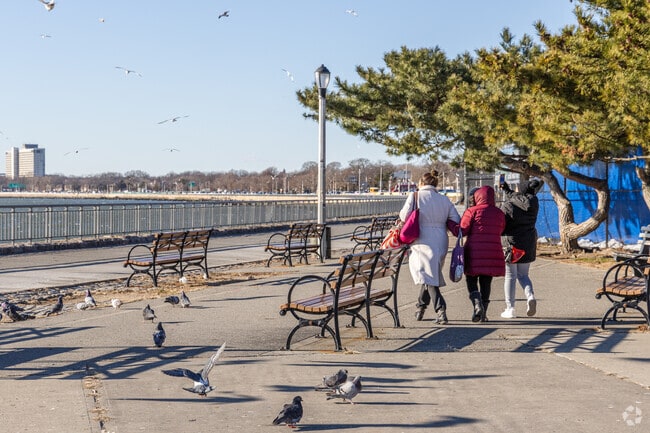 Family walking on Shore Parkway in Bath Beach.