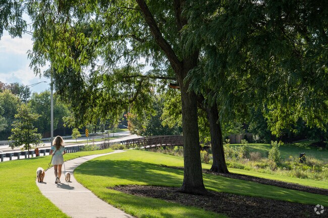 A resident of Brook Crossing takes advantage of the afternoon sun in Brook Crossings Park.