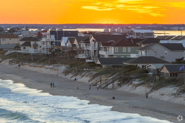 Living in Surf City, NC, means enjoying sandy shores, and stunning sunsets.