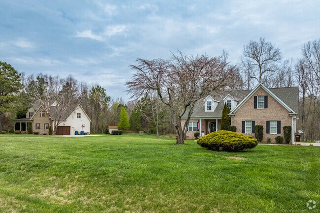 Newer two-story homes in Hodgin Valley draw on Cape Cod styles.