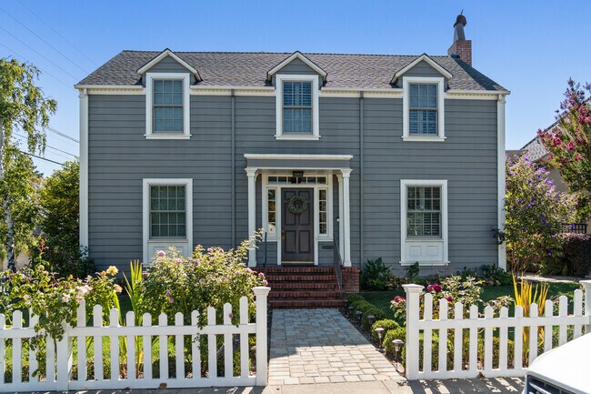 This Baywood-Aragon home boasts classic colonial architecture with charming dormer windows.
