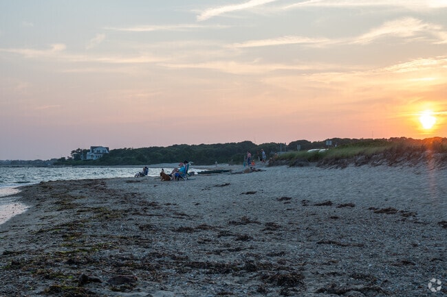 East Falmouth residents take in the sunset from Menauhant Town Beach in East Falmouth.