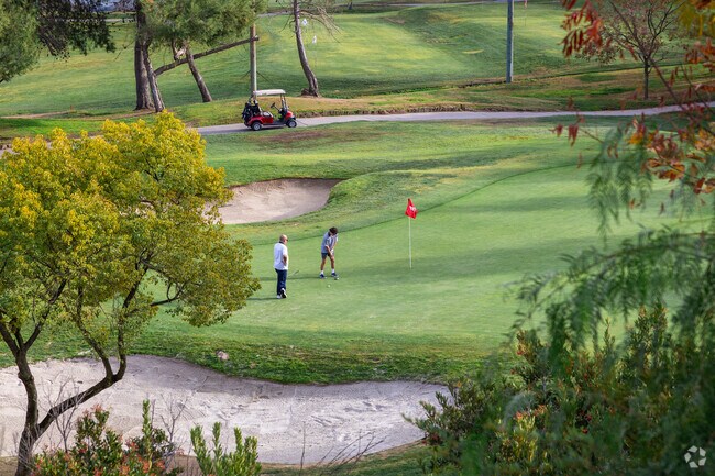 Spend the day on the greens at the Red Hawk Golf Club near Paseo del Sol.