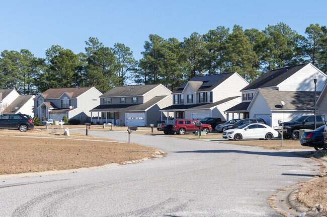 Houses are surrounded by large trees and a well-kept gardens in Northeast Columbia.