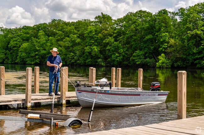 Residents of the Lansing-Eaton neighborhood head to the public boat launch.