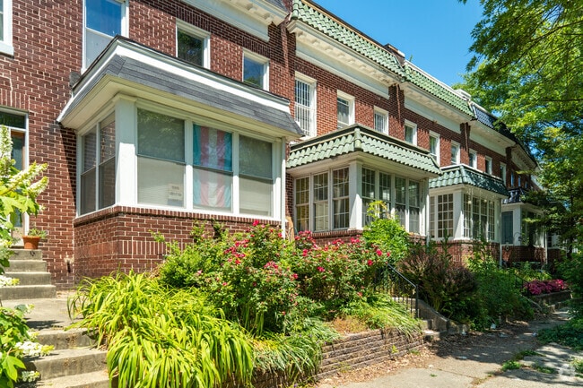 Glass covered sun porches bring four season use to these unique row homes in Better Waverly.