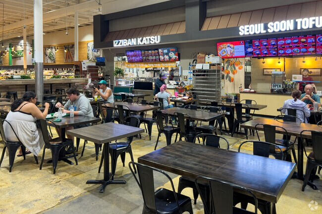 West Colonial residents enjoy a bite to eat while shopping at the Lotte Market.