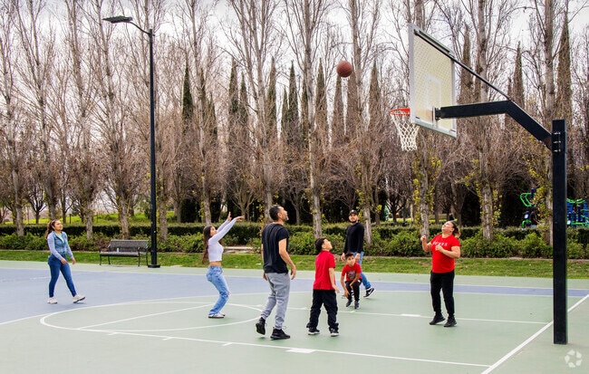 Residents play basketball at the Central Community Park in the City of Mountain House.