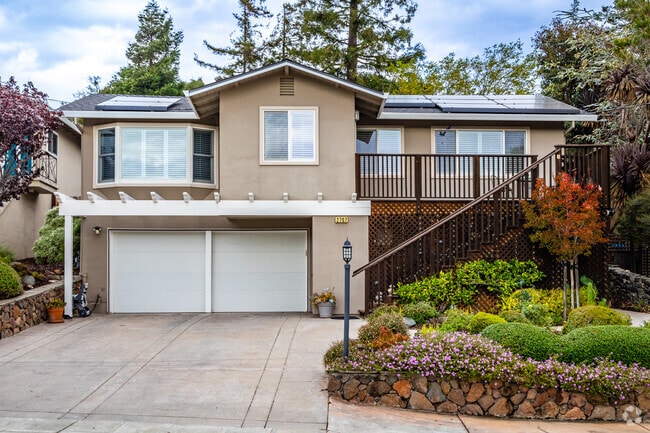 Homes atop garages are common in the hills of Belmont Country Club.