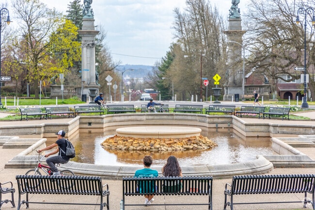 Highland Park residents relax at a bench.