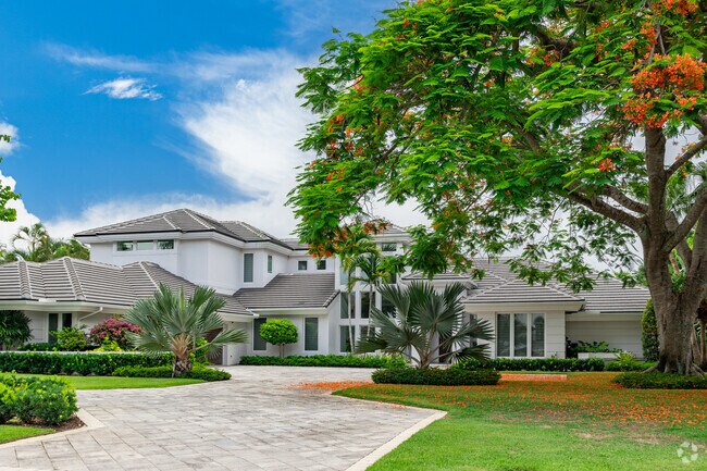 Many Grey Oaks homes feature updated designs and lush landscaping.