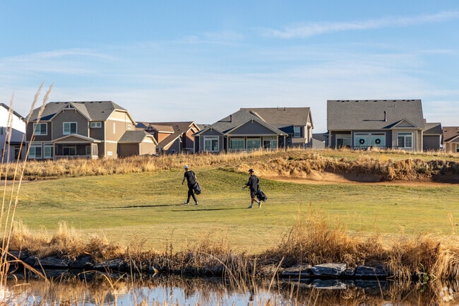 Two golfers stroll the course at the Buffalo Run Golf Course.