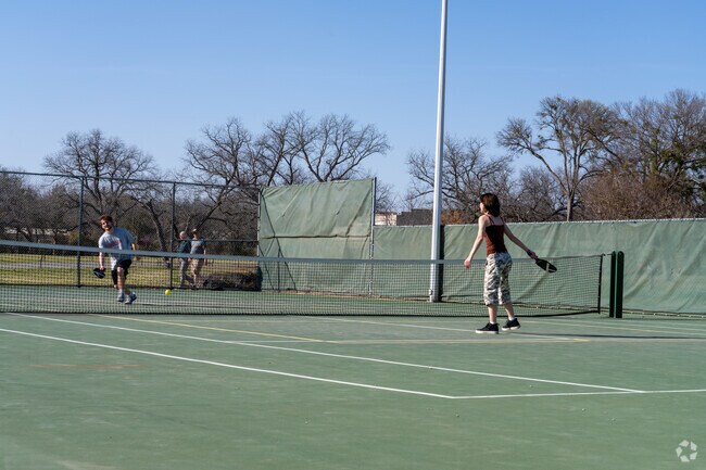 Stephenville locals enjoy a friendly game of tennis at Stephenville Park.