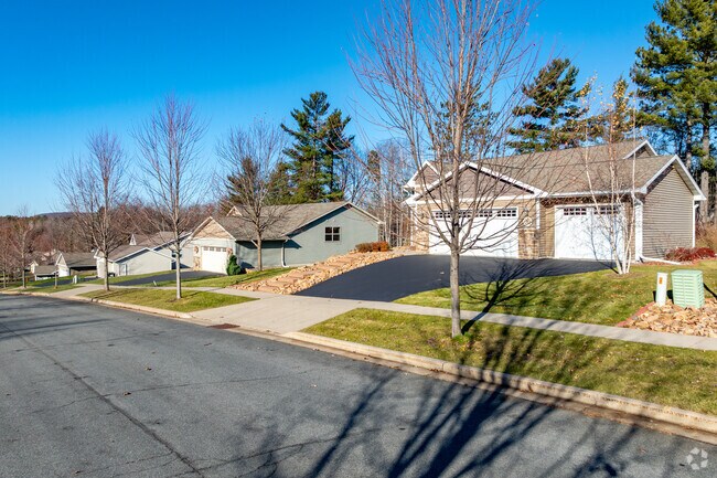 Tree-lined sidewalks add charm to Rothschild neighborhoods.
