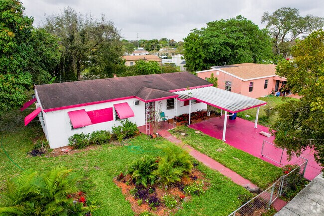 Many homes in the Bunche Park neighborhood have brightly colored features.