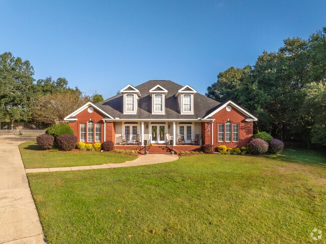 Brick homes with Colonial influences are common in D'Iberville neighborhoods.