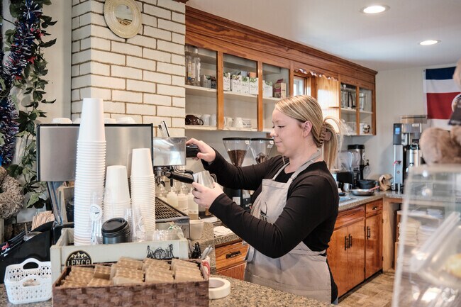 Baristas at Pura Vida Coffee craft delicious beverages for Fountainhead-Orchard Hills locals.