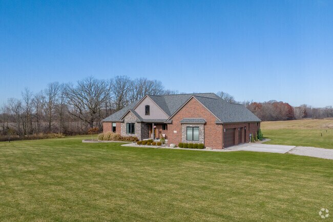 Modern traditional brick homes in Lenox Township enjoy large lots surrounded by woods.