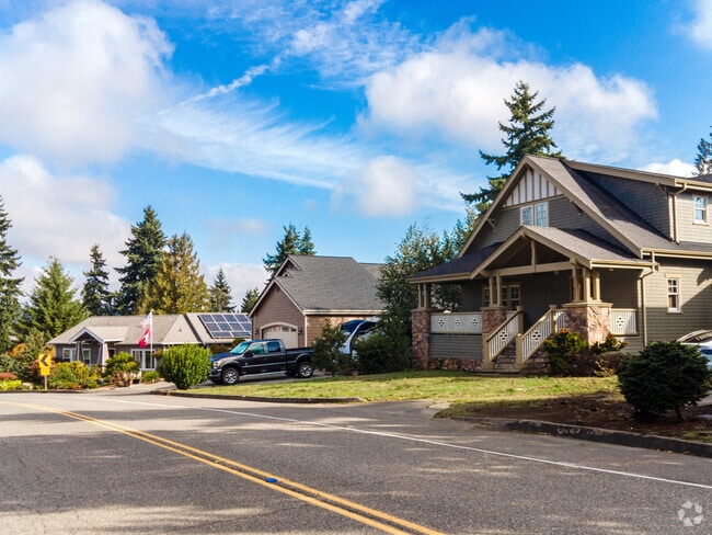 A row of spacious lakefront homes lines the shore in Lake Burien.